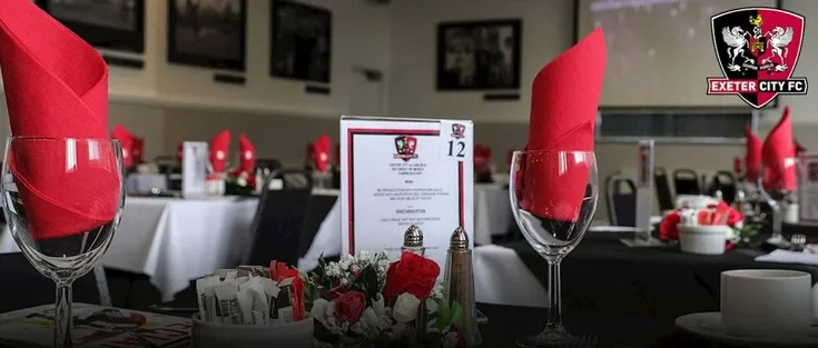 Khu vực hospitality tại sân St. James Park, Exeter, với không gian thoải mái và nội thất hiện đại